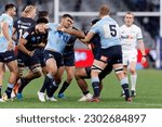 Small photo of Jordan Uelese of the Rebels pulls Izaia Perese of the Waratahs jersey during the Super Rugby Pacific match between the Waratahs and the Rebels at Allianz Stadium on May 13, 2023 in Sydney, Australia
