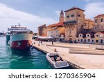 Historic buildings on promenade in Trogir, Croatia. Trogir is popular travel destination in Croatia. Trogir, as a UNESCO World Heritage Site, is one of most visited places in Dalmatia, Croatia.