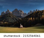 Autumn at San Giovanni in Ranui Church and and Dolomites mountains in the background in Val di Funes, South Tyrol, Italy, Europe. (St John in Ranui church).
