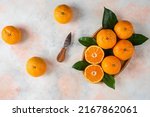 Small photo of top view fresh sliced orange on dark background ripe mellow fruit juice color citrus tree citrus, Whole and sliced ripe oranges placed on marble background, half orange fruit.