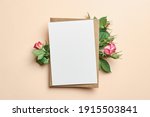 Greeting card with fresh roses flowers on paper background
