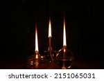 Small photo of candle burning at night photog