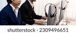 Small photo of Panorama focus headset on call center workspace desk with blur background of operator team or telesales representative engage in providing client with customer support service or making sales. Prodigy