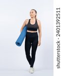Small photo of Full body length shot athletic and sporty senior woman holding fitness exercising mat on isolated background. Healthy active physique and body care lifestyle after retirement. Clout