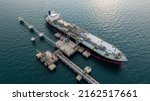 Small photo of Aerial view petrochemical tanker park offshore at oil terminal commercial port for transfer crude oil to oil refinery, Global business logistic industrial crude oil and fuel tanker ship.