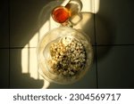 Small photo of Tangerang, Banter - May 17th 2023 - Photo of tea and popcorn from top.