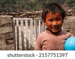 Small photo of Lukla, Nepal - 9 Mar 2012 A Sherpa child living in the Himalayas.