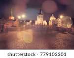 Charles Bridge at night in bokeh light, Prague, Czech Republic