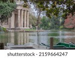The temple of Aesculapius is located on an artificial islet of the lake located in the Garden of the Lake of Villa Borghese in Rome.
