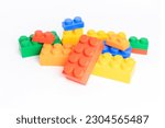 Pile plastic toy blocks on...