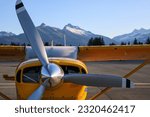 Small photo of Yellow bush plane, workhorse of the great northern wilderness. Three bladed propeller powers the stout and reliable high wing aircraft. Remote and isolated communities rely on air travel