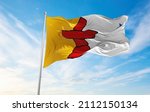 flag of Nunavut , Canada at cloudy sky background on sunset, panoramic view. Canadian travel and patriot concept. copy space for wide banner. 3d illustration