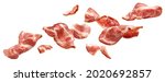 Sliced bacon isolated on white background, falling ham strips