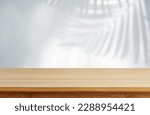 Aesthetic Wooden Table with realistic tropical leaves shadow overlay effect white wall