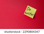 Do better symbol. Orange steaky note with concept words do better. Beautiful red background. Business and Do better concept. Copy space.