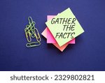 Small photo of Gather the facts symbol. Yellow steaky note with paper clips with words Gather the facts. Beautiful deep blue background. Business and Gather the facts concept. Copy space.