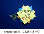 Small photo of Gather the facts symbol. Yellow steaky note with words Gather the facts. Beautiful deep blue background. Business and Gather the facts concept. Copy space. Conceptual word