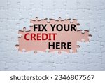 Small photo of Fix your credit here symbol. Concept words Fix your credit here on white puzzle. Beautiful pink background. Business and Fix your credit here concept. Copy space. Concept word