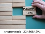 Small photo of Personal Loan symbol. Concept word Personal Loan on wooden blocks. Businessman hand. Beautiful grey green background. Business and Personal Loan concept. Copy space
