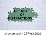 Small photo of Distractions symbol. Concept word Get rid of Distractions on white puzzle. Beautiful grey green background. Business and Get rid of Distractions concept. Copy space