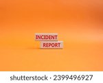 Small photo of Incident Report symbol. Concept word Incident Report on wooden blocks. Beautiful orange background. Business and Incident Report concept. Copy space