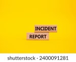 Small photo of Incident Report symbol. Concept word Incident Report on wooden blocks. Beautiful yellow background. Business and Incident Report concept. Copy space