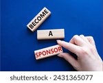 Small photo of Become a sponsor symbol. Concept word Become a sponsor on wooden blocks. Businessman hand. Beautiful deep blue background. Business and Become a sponsor concept. Copy space