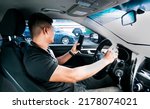 Small photo of Distracted driver using the cell phone while driving, Man using his phone while driving, Person holding the cell phone and with the other hand the steering wheel, Concept of irresponsible driving