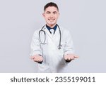 Small photo of Cheerful doctor extending hands welcome. Friendly doctor extending hand in welcome isolated. Happy doctor extending hand to camera