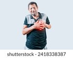 Small photo of Elderly person with heart problems. Senior man with tachycardia touching his chest. Old man with heart pain touching chest isolated