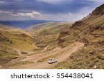 A car driving the hairpin turns of the Sani Pass on the border of South Africa and Lesotho.