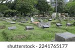 Small photo of The public cemetery complex (TPU) at Karet Bivouac, people making pilgrimages, funeral officials, people sowing flowers. Jakarta-Indonesia-December 2022.