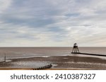Small photo of Lighthouse in the sea, Dovercourt low lighthouse at low tide built in 1863 and discontinued in 1917 and restored in 1980 the 8 meter lighthouse is still a iconic sight, with sailing boats sailing past