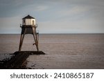Small photo of Lighthouse in the sea, Dovercourt low lighthouse at low tide built in 1863 and discontinued in 1917 and restored in 1980 the 8 meter lighthouse is still a iconic sight, with sailing boats sailing past