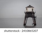 Small photo of Lighthouse in the sea, Dovercourt low lighthouse at high tide built in 1863 and discontinued in 1917 and restored in 1980 the 8 meter lighthouse is still a iconic sight