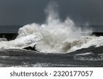 Stormy waves over pier, north of Portugal