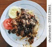 Small photo of Central Java, 22 May 2022. Sate Buntel made from goad meat , the hint of smoky from grill make this food taste good