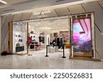 Small photo of DAMANSARA, MALAYSIA - 23 DEC 2022: Kate Spade fashion store interior in a Shopping Mall, Malaysia. Kate Spade is an American fashion design house founded in 1993.