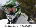 Small photo of woman snowmachine rider suited up and ready for the trails