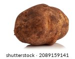 Dirty potatoes in clods of soil on a white background