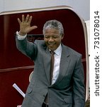 Small photo of Washington, DC. USA, 24th June, 1990 Nelson Mandela along with his wife Winnie arrive at National Airport. He is greeted by Randall Robinson, Effie Barry, and Congressman Walter Fountry