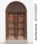 Small photo of Traditional Zanzibar door with spikes. Indian door style.