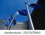 European flags in front of the Berlaymont building, headquarters of the European Commission in Brussels, Belgium