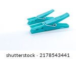 plastic clothespins with different colors like green, pink, blue, orange on white background