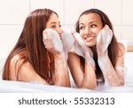 Small photo of two tricksy beautiful women in jacuzzi with foam on hands