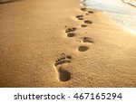 Footprints At Sunset With...
