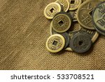 Old Chinese Coin On Sackcloth