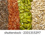Small photo of This is a photo shot of collage of various seeds stripes, including flax seed, chia seed, pumpkin seed and sunflower seed.