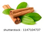 Small photo of Ceylon cinnamon sticks and fresh cinnamon leaves isolated on white