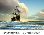 Pirate Ship At The Open Sea At...